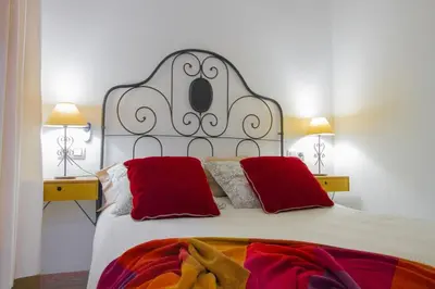 a bedroom with a closet with a mirror and a bed at Armapana in Barcelona