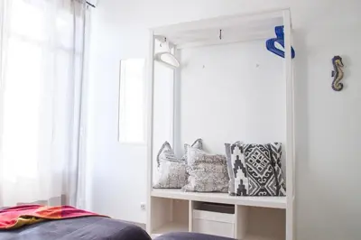 a bedroom with a bed with a lamp and a plant at Armapana in Barcelona