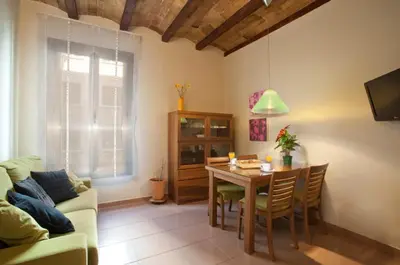 a living room with a table and a couch at BCNGOTIC 13 in Barcelona