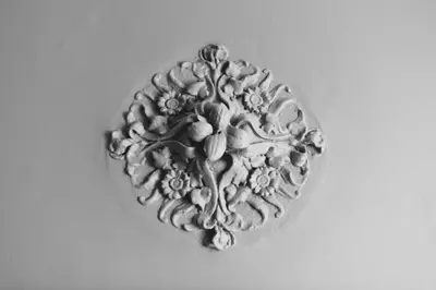 a silver button with flowers on a white background at Circa 1905 in Barcelona