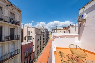 a view from the balcony of a building with chairs at AinB Barcelona Sants Apartments in Barcelona