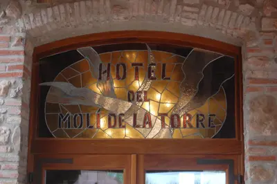 a stained glass window on the door of a building at Hotel Moli De La Torre in Bigues i Riells