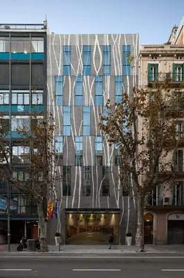 an office lobby with a ring sign on the wall at Ako Suite Hotel in Barcelona