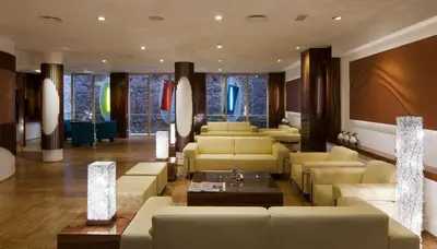 a lobby with two large columns in a building at Ako Suite Hotel in Barcelona