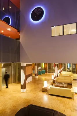 a living room with a couch and a table at Ako Suite Hotel in Barcelona