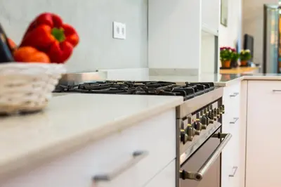 a kitchen with a stove and a basket of fruit at Montaber Apartment - Trafalgar in Barcelona