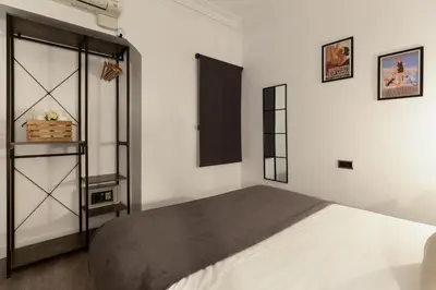 a bedroom with a large bed in a room at KeyFamily Paradise in Barcelona