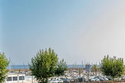 a parking lot with a lot of parked cars at Terrassa de Mar Apartment in Masnou