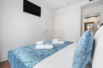 a bedroom with a bed with towels on it at Sensation Sagrada Familia in Barcelona