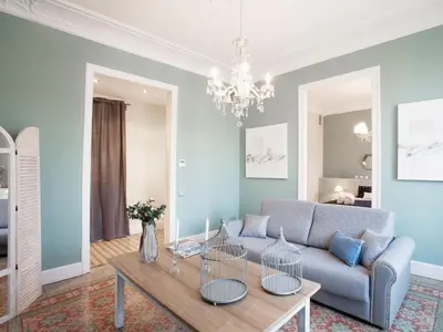 a living room with a couch and a table at BCN Rambla Catalunya Apartments in Barcelona