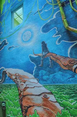 a painting of a dog on the side of a building at Itaca Hostel in Barcelona