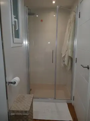 a shower with a glass door in a bathroom at Sitges - Apartamento in Sitges
