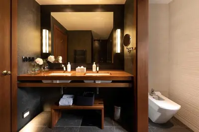 a bathroom with a sink and a mirror and a toilet at Primero Primera in Barcelona