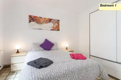 a bedroom with a bed with two pillows on it at Apartamento Joel in Barcelona