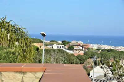 a view of the ocean from the roof of a house at VILLA SOFIA CALELLA in Calella