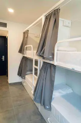 a room with bunk beds in a dorm room at Sea Hostel Barcelona in Barcelona