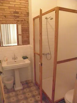 a bathroom with a shower and a sink at Hostal Cal Pla in Sant Llorenc Savall