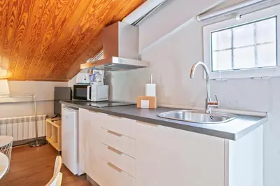 a small kitchen with a sink and a window at Alcam Studio Alio3 in Barcelona