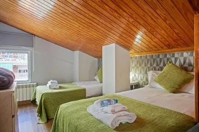 a bedroom with two beds with towels on them at Alcam Studio Alio3 in Barcelona