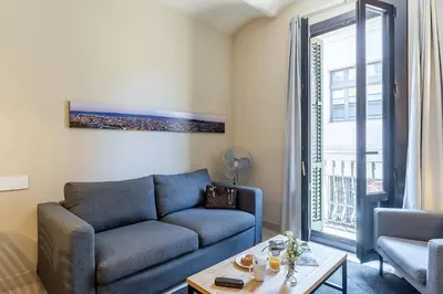 a living room with a couch and a table at AB Poble Nou Venero in Barcelona