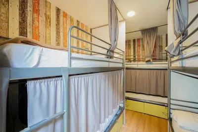 a room with two bunk beds and a window at Casa Barcelo Camp Nou Barcelona in Hospitalet de Llobregat