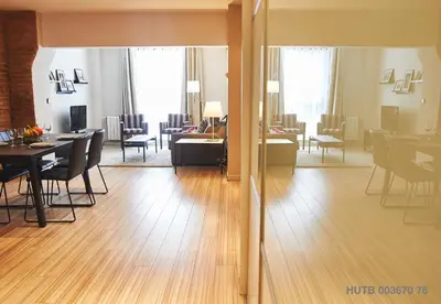 a living room and dining room with a table and a living room at Alcam Alio 1 in Barcelona