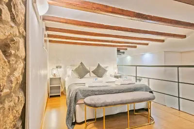a bedroom with a bed in a room at Alcam Loft Grassot in Barcelona