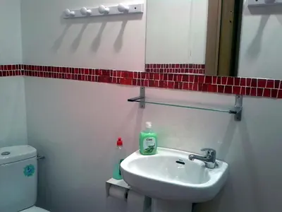 a bathroom with a sink and a mirror and a toilet at Barcelona Rooms 294 in Barcelona