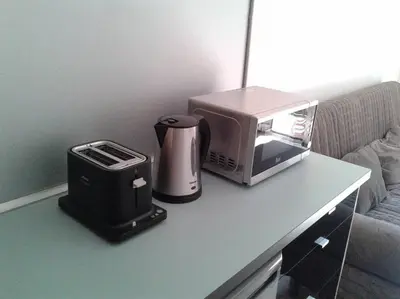 a coffee maker and a toaster on a table at Lovely double apartment - Sagrada Familia - Air conditioning in Barcelona