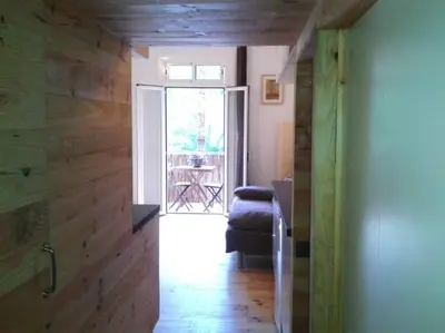 a hallway with a door leading to a room with a patio at Lovely double apartment - Sagrada Familia - Air conditioning in Barcelona