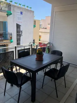 a black table and chairs on a balcony at Apartamento Montroig 1 in Sitges