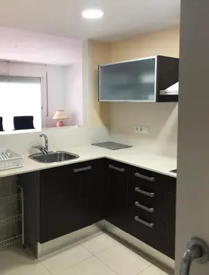 a kitchen with a sink and a counter top at Apartamento Montroig 1 in Sitges