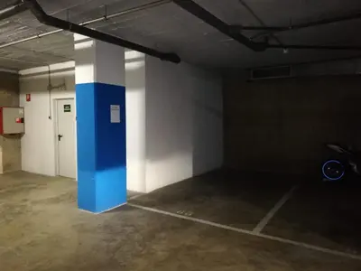 an empty room with a blue pillar in a building at Duplex in Santa María de Barbará