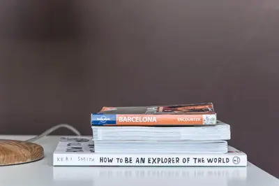 a stack of books sitting on top of a table at The Vintage Rentals in Barcelona