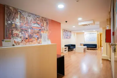 a waiting room with a large painting on the wall at Hostal Fina in Barcelona
