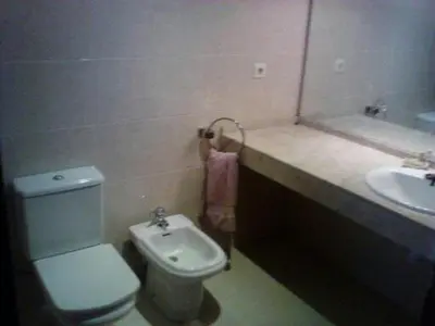 a bathroom with a toilet and a sink at Playa y Sol in Cubelles