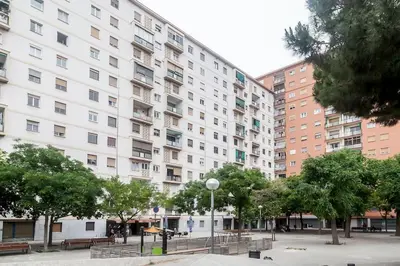a large white building with trees in front of it at 8 min walk to the beach & 10 min walk to Convention Centre ! in Barcelona
