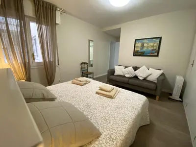 a living room with two beds and a couch at Ponent - Espectaculares vistas al mar in San Pol de Mar