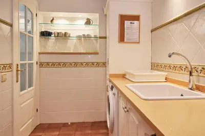 a white bathroom with a sink and a sinkiterator at ARTS HOUSE - Cabrils, Maresme, Barcelona in Cabrils