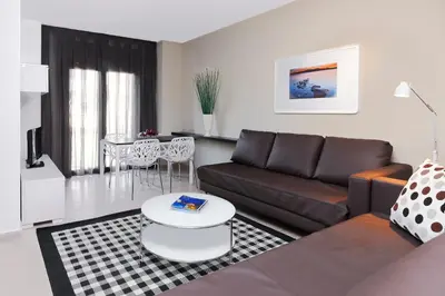 a living room with a couch and a table at Barcelona Apartment Gran de Gràcia in Barcelona
