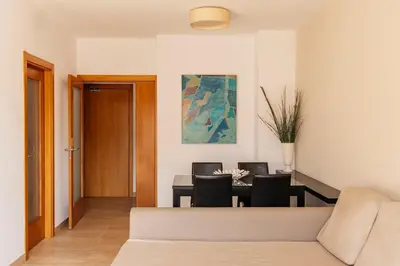 a bedroom with a large bed and two night stands at Barcelona Apartment Gran de Gràcia in Barcelona