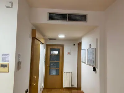 a hallway with a door in a building at Apartamentos City Beach in Barcelona