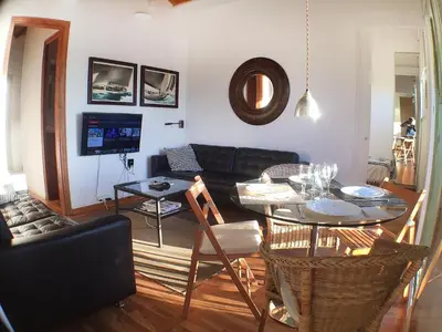 a living room with a couch and a table at Barceloneta Port Ramblas in Barcelona