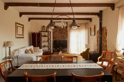 a living room with a table with a keyboard at Amazing Vila close to Sitges, jacuzzi, swimming pool & exellent views in Olivella