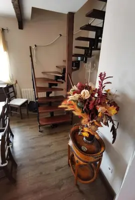 a vase of flowers on a table in a room at Amazing Vila close to Sitges, jacuzzi, swimming pool & exellent views in Olivella