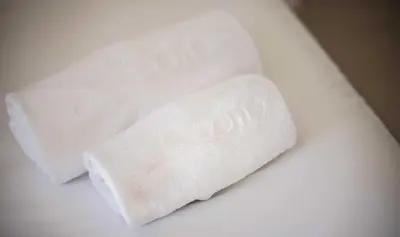 two rolls of white toilet paper sitting on a table at Sono & SPA - Adults Only in La Garriga