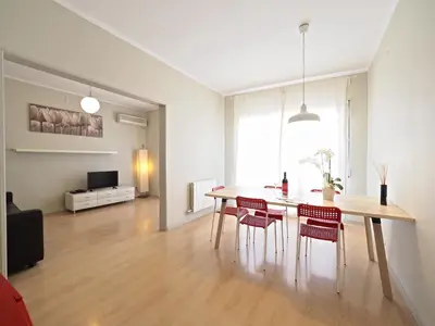 a dining room with a table and chairs at Sagrada Penthouse in Barcelona