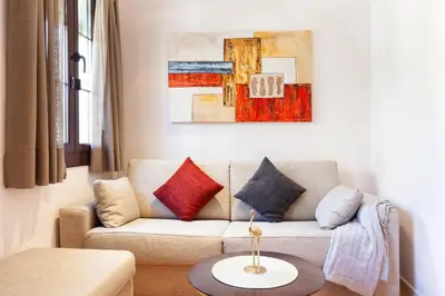 a living room with a couch and a table at Dream Gracia Apartments in Barcelona