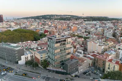 an aerial view of a city with buildings at Cosmo Suite Penthouse in Barcelona