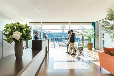 a group of people standing in a lobby at Sleep&Fly in El Prat de Llobregat